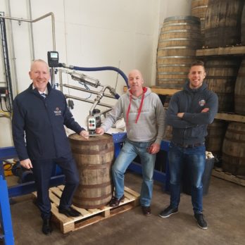 Walsh Whiskey Releases The Irishman Single Malt – Coffee Stout Finish in Association with Dick Mack’s Brewhouse Pictured in January 2018 at Walsh Whiskey Distillery (Royal Oak, Co. Carlow) filling the Dick Mack’s Brewhouse - Coffee Stout Cask with The Irishman – Single Malt premium whiskey are: Bernard Walsh, Managing Director, Walsh Whiskey Distillery; Peter White (Dick Mack’s & Irish Whiskey Society) and Finn MacDonnell, Dick Mack’s Brewhouse (Dingle, County Kerry) and Grandson of Dick Mack himself.